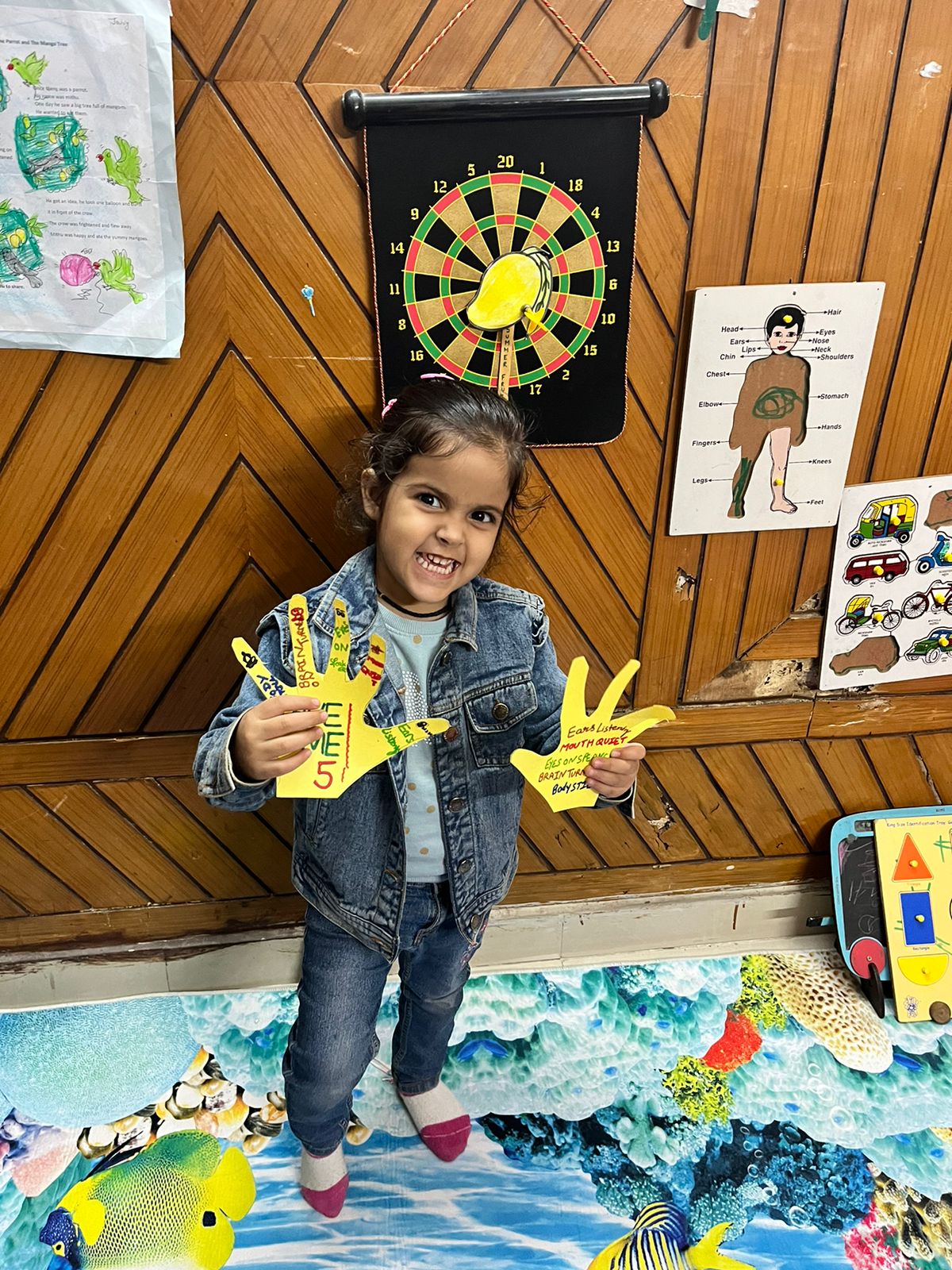 best tuition center near me in chandigarh:- kid with playcard